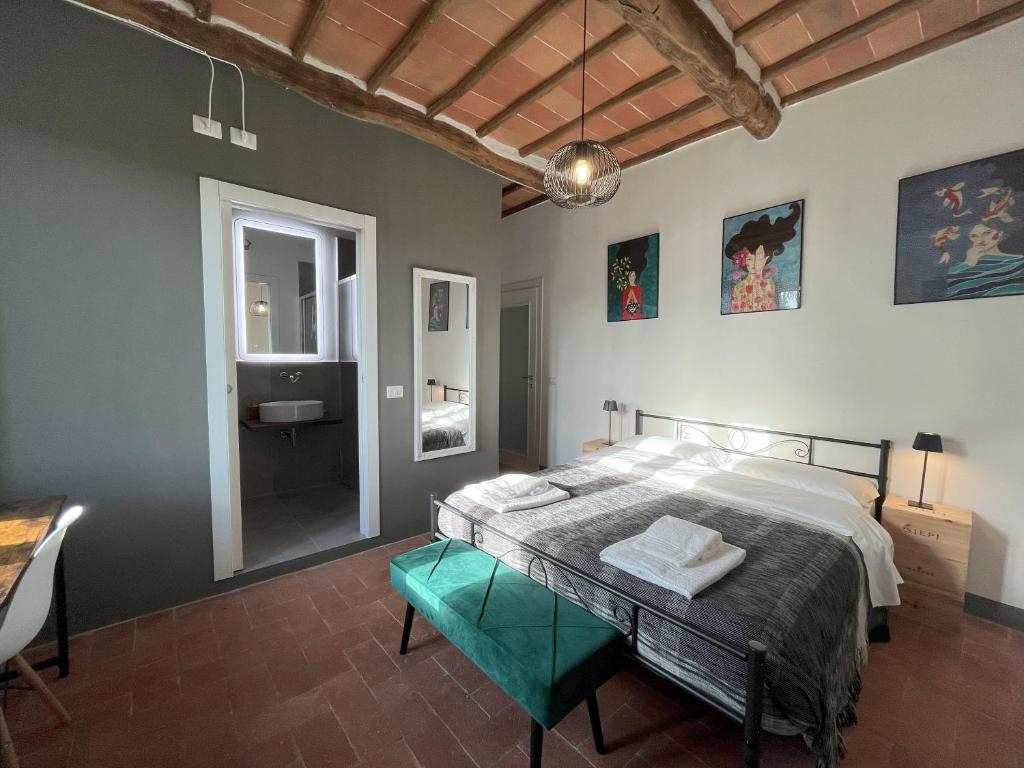 Postel nebo postele na pokoji v ubytování Chianti dreaming in Radda