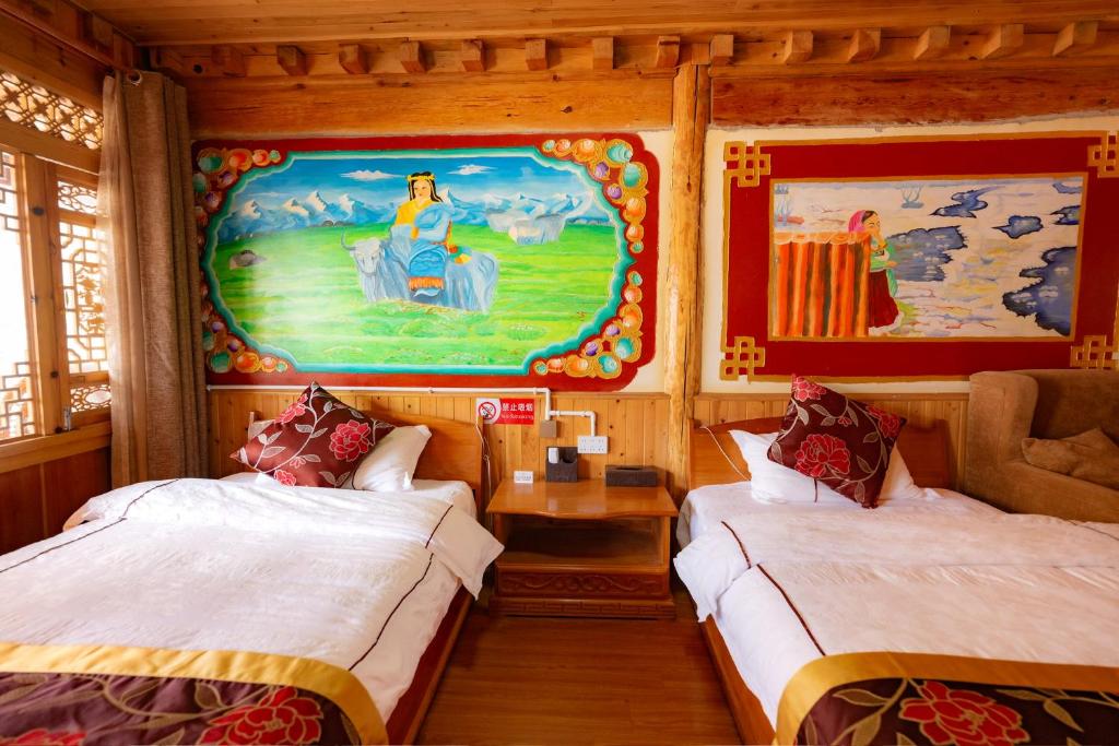 Postel nebo postele na pokoji v ubytování TIBET Guest house 虎跳峡卓玛客栈
