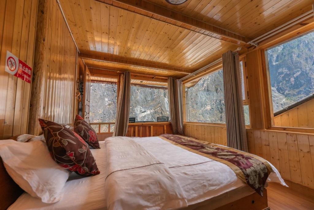 Postel nebo postele na pokoji v ubytování TIBET Guest house 虎跳峡卓玛客栈