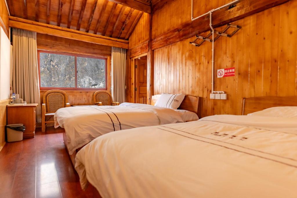 Postel nebo postele na pokoji v ubytování TIBET Guest house 虎跳峡卓玛客栈