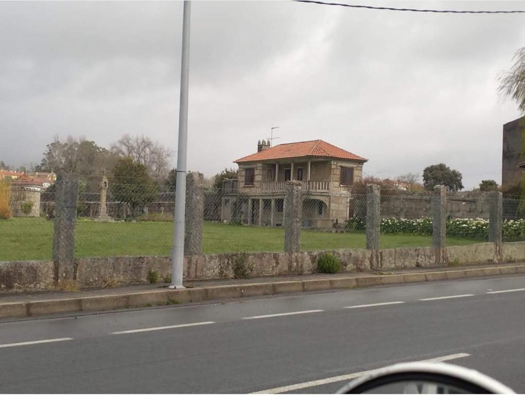 an old house on the side of a road at Caticobas in San Pedro