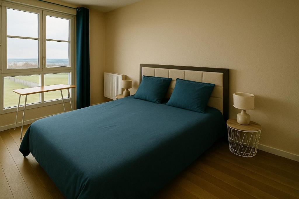 Ένα ή περισσότερα κρεβάτια σε δωμάτιο στο Appartement Cosy Proche Disneyland - tout Confort