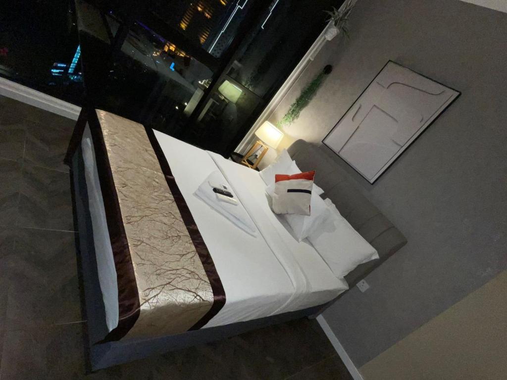 Postel nebo postele na pokoji v ubytování My Residence Villa Scarletz KLCC