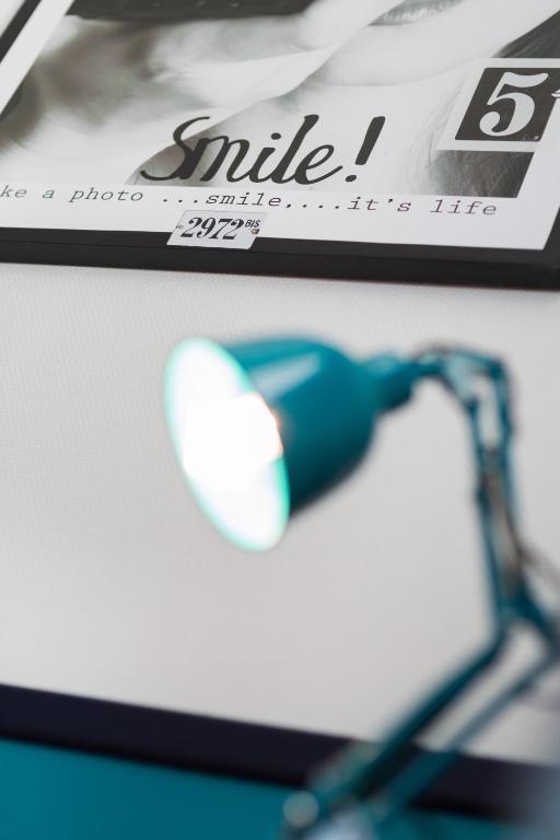 a close up of a white and blue object on a table at Hotel Nap By HappyCulture in Nice