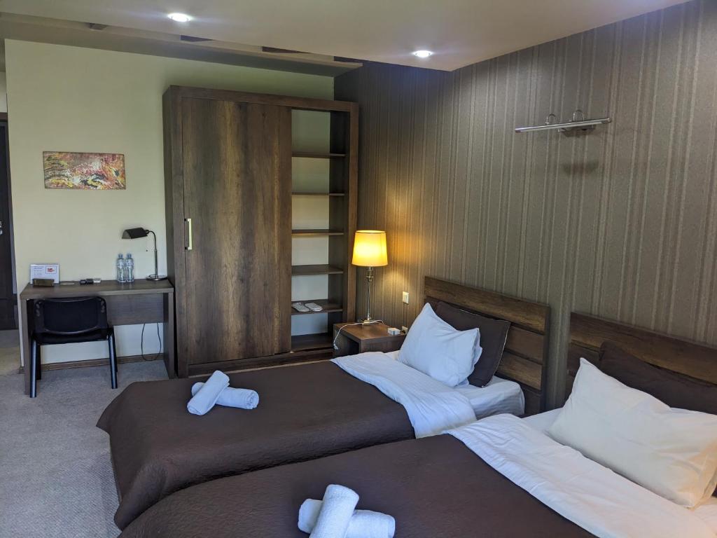 Postel nebo postele na pokoji v ubytování Sani Hotel
