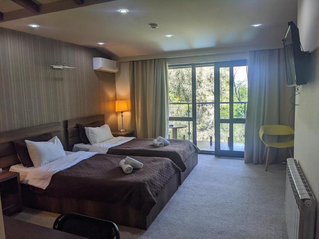 Postel nebo postele na pokoji v ubytování Sani Hotel