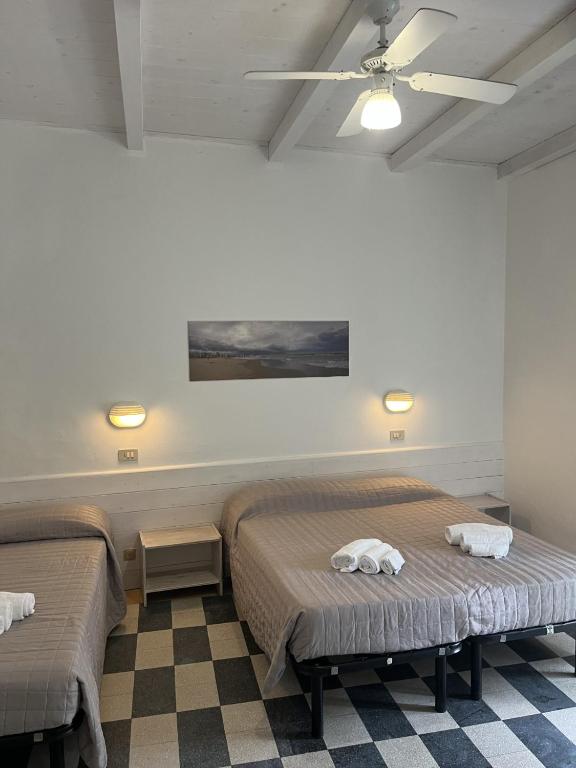 Postel nebo postele na pokoji v ubytování Hotel Roma