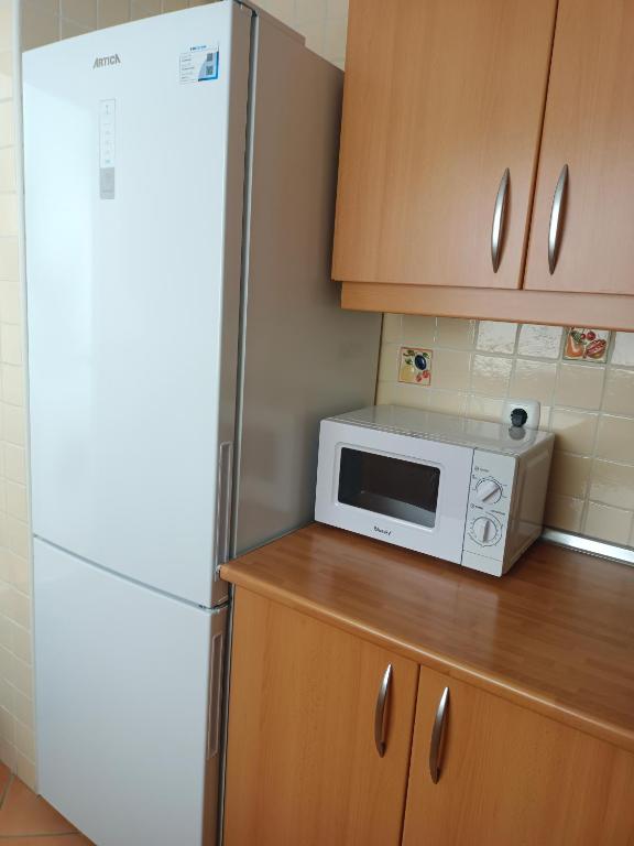 Kuchyň nebo kuchyňský kout v ubytování Bonito ático con terraza