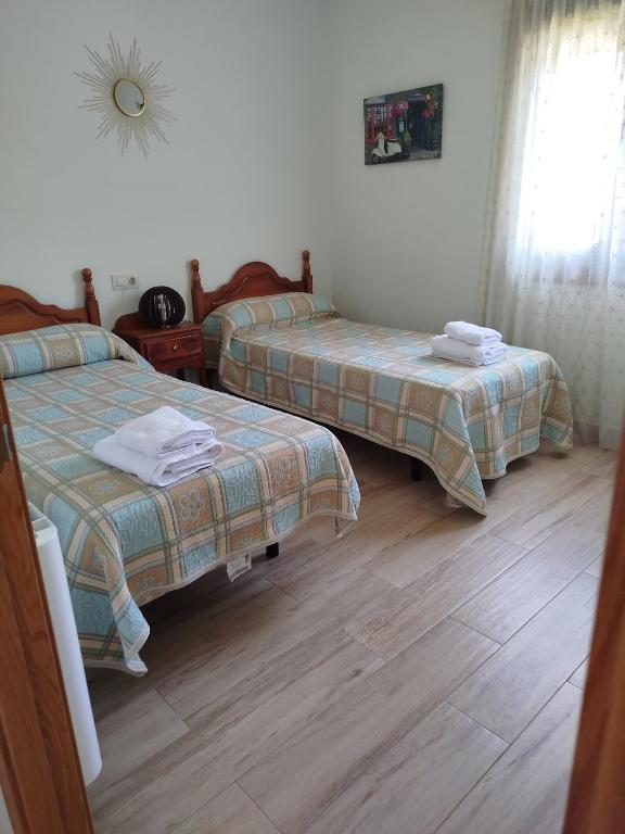 Posteľ alebo postele v izbe v ubytovaní O lar de udala