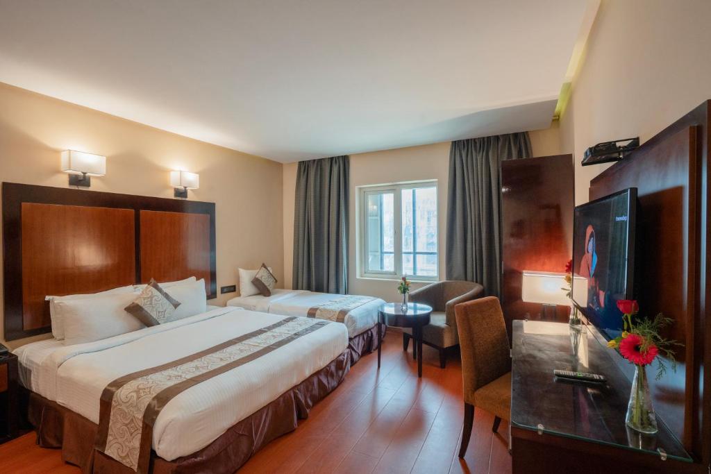 Postel nebo postele na pokoji v ubytování Park Avenue Hotel Nungambakkam