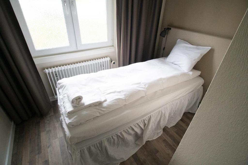 Postel nebo postele na pokoji v ubytování Lycksele Inn