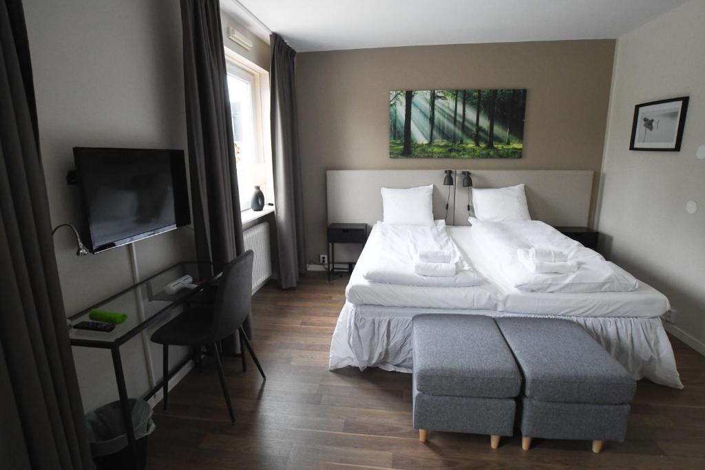 Postel nebo postele na pokoji v ubytování Lycksele Inn