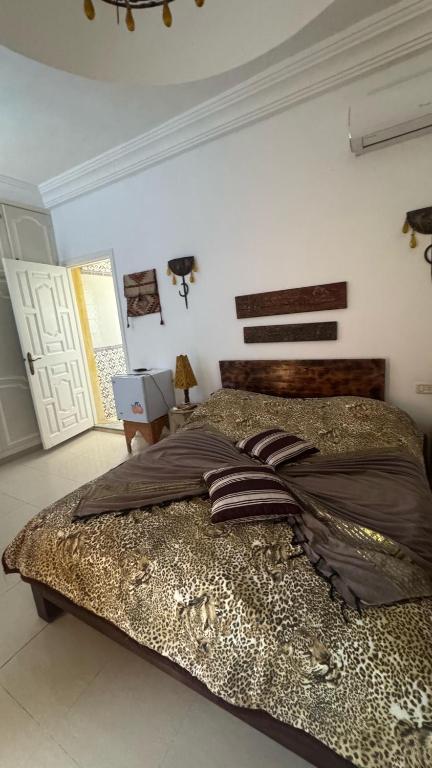 Postel nebo postele na pokoji v ubytování maison d hôte rêve de désert jerba