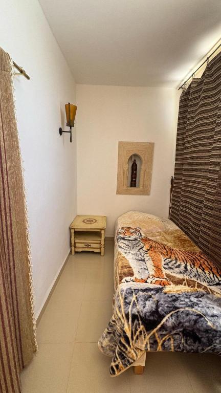 Postel nebo postele na pokoji v ubytování maison d hôte rêve de désert jerba