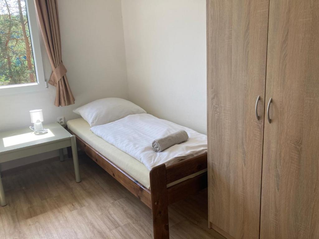 Postel nebo postele na pokoji v ubytování Penzion Cholín