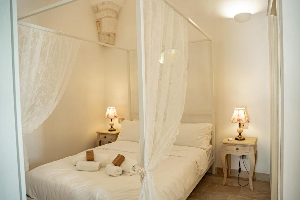 Ένα ή περισσότερα κρεβάτια σε δωμάτιο στο "Casa Tramonto" - Historic Center of Ostuni