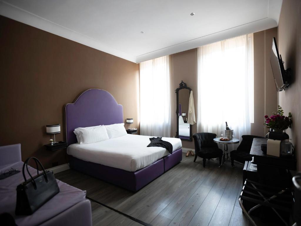 Posteľ alebo postele v izbe v ubytovaní JB Relais- Campo de' Fiori