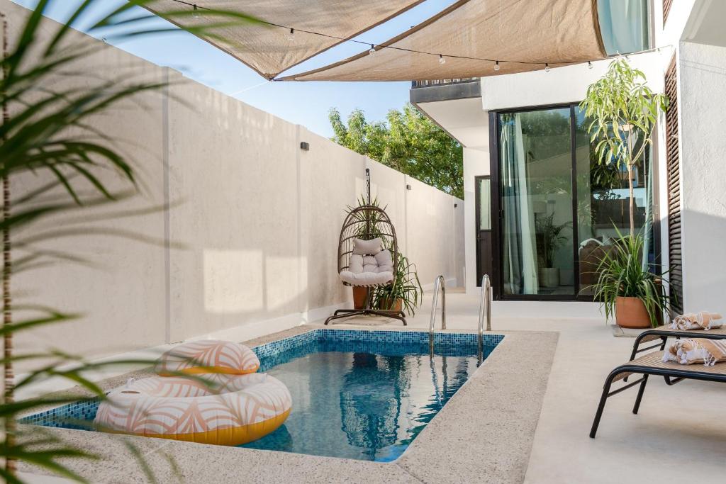 a swimming pool in the backyard of a house at Casa Eva -Ocean View Rooftop, Pool - La Punta in Puerto Escondido