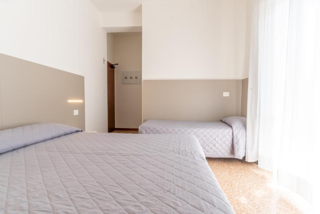 Postel nebo postele na pokoji v ubytování Hotel Ischia
