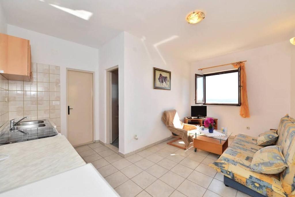 Ένα ή περισσότερα κρεβάτια σε δωμάτιο στο Apartament Karla