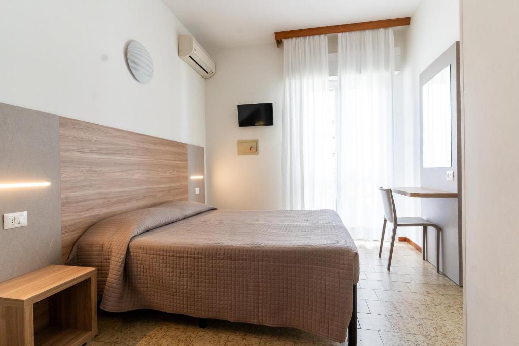 Postel nebo postele na pokoji v ubytování Hotel Ischia