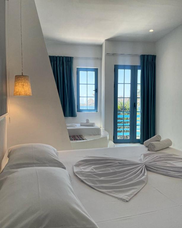 Postel nebo postele na pokoji v ubytování Cava Boutique Hotel