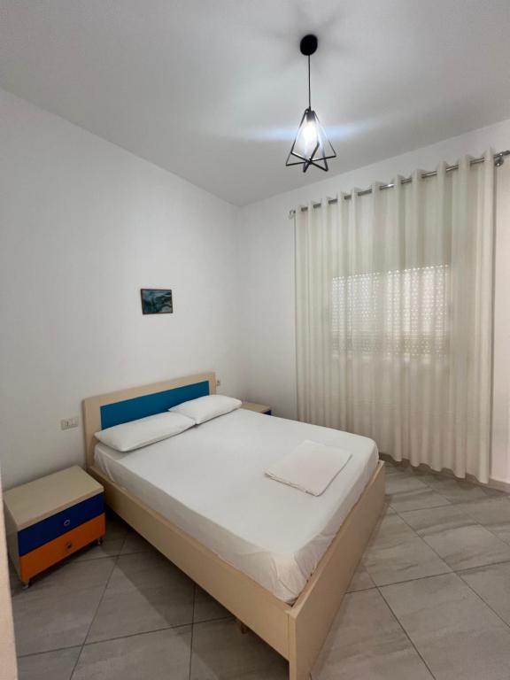 Postel nebo postele na pokoji v ubytování Guest House Vlore