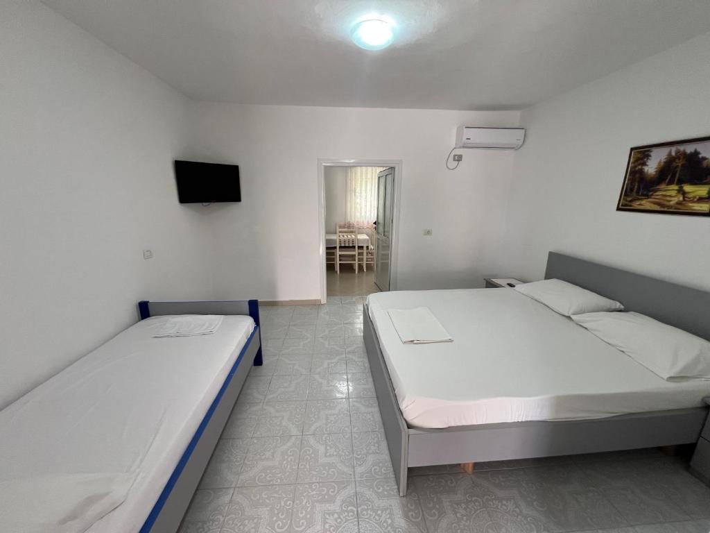 Postel nebo postele na pokoji v ubytování Guest House Vlore