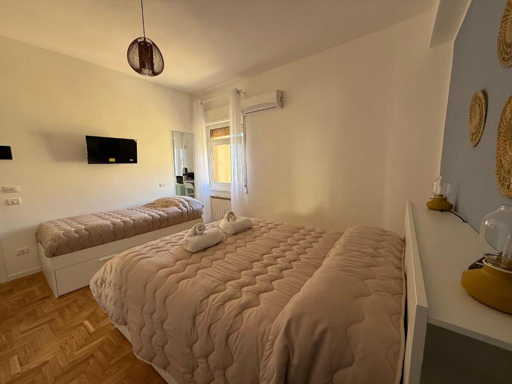 Postel nebo postele na pokoji v ubytování MiraValle Agrigento 2