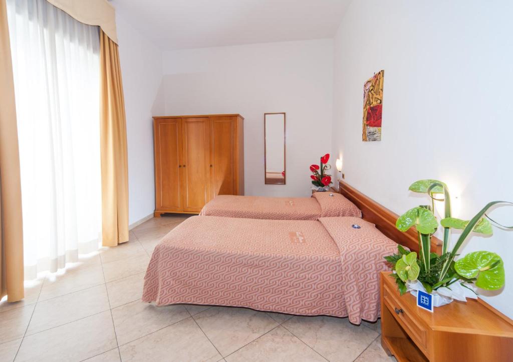 Postel nebo postele na pokoji v ubytování Joli Park Hotel - Caroli Hotels