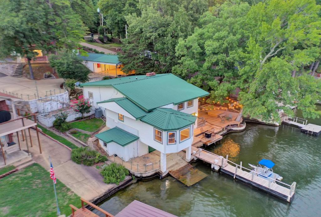 an aerial view of a house on the water at Lake Haven Estate with Hot Tub, Game Room and Pontoon Boat, 4BR, 4 Bathoom, 2 Kitchens in Hot Springs