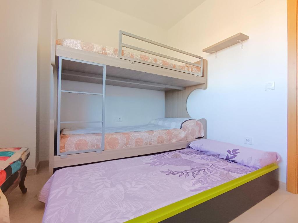 Posteľ alebo postele v izbe v ubytovaní Ayf 3 habitaciones en 1ª linea de playa