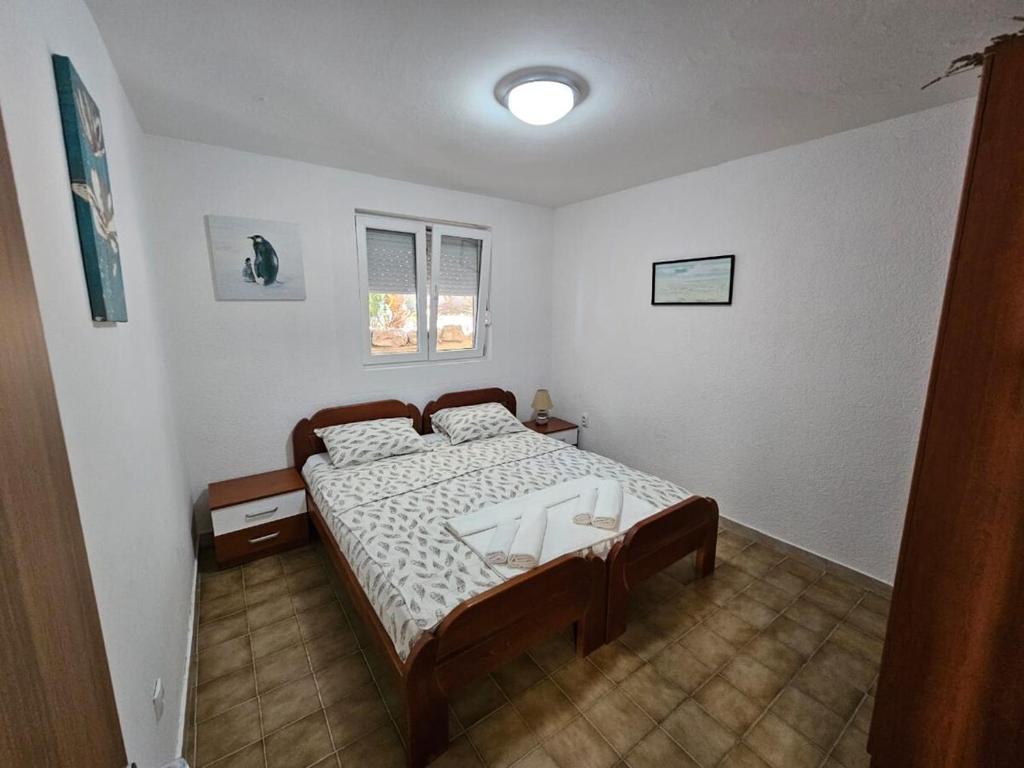 Postel nebo postele na pokoji v ubytování Vila Lučica apartman pogled na more