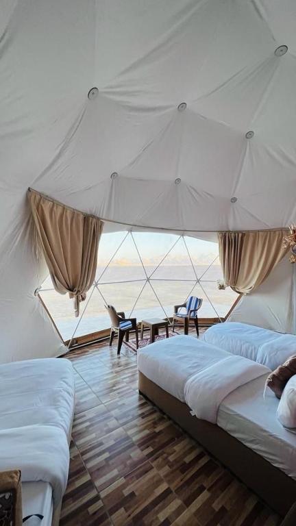 Postel nebo postele na pokoji v ubytování panorama luxury camp