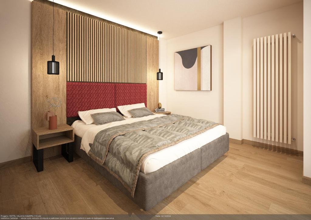 Postel nebo postele na pokoji v ubytování Hotel Valacia