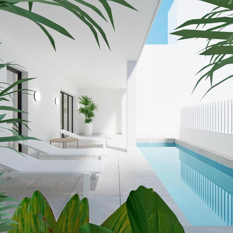 a rendering of a swimming pool with plants at Valencia Living Suites in Picanya