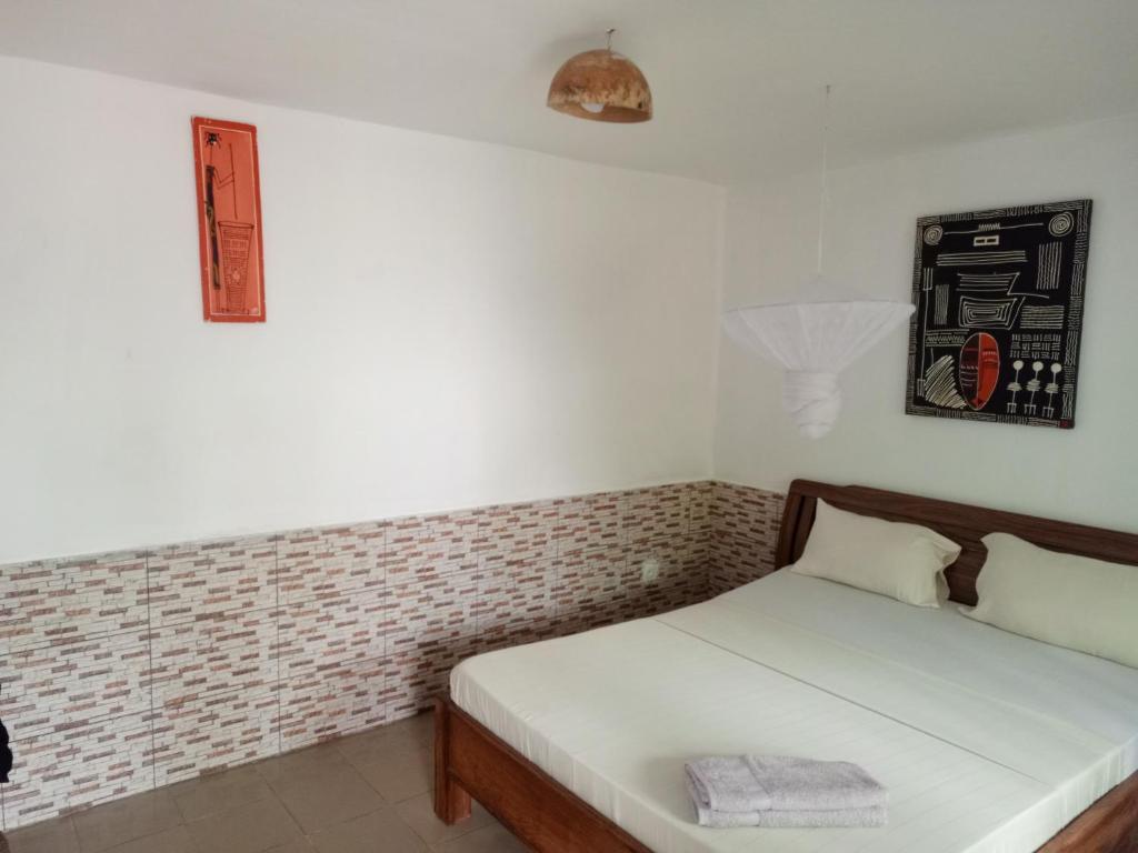 Postel nebo postele na pokoji v ubytování Casa Cacheu Homestay Guest House