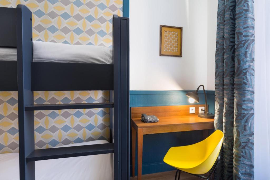 a bunk bed room with a desk and a yellow chair at Hotel Nap By HappyCulture in Nice