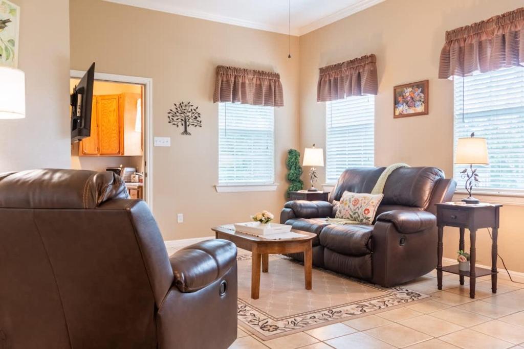 a living room with two chairs and a couch at The Nest 1 Bedroom Suite 12 min from Magnolia in Bellmead
