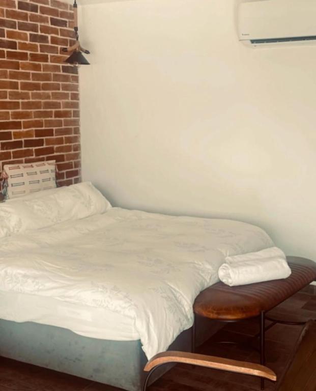 Postel nebo postele na pokoji v ubytování NELLA SUITE