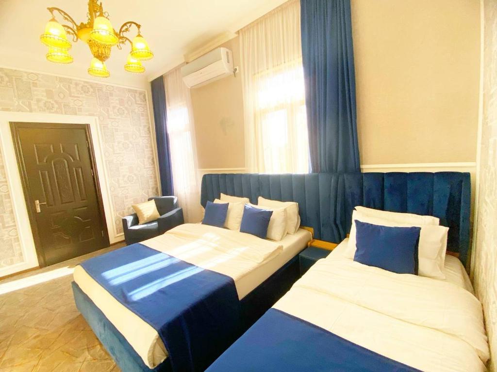Postel nebo postele na pokoji v ubytování Hotel Orange Kutaisi