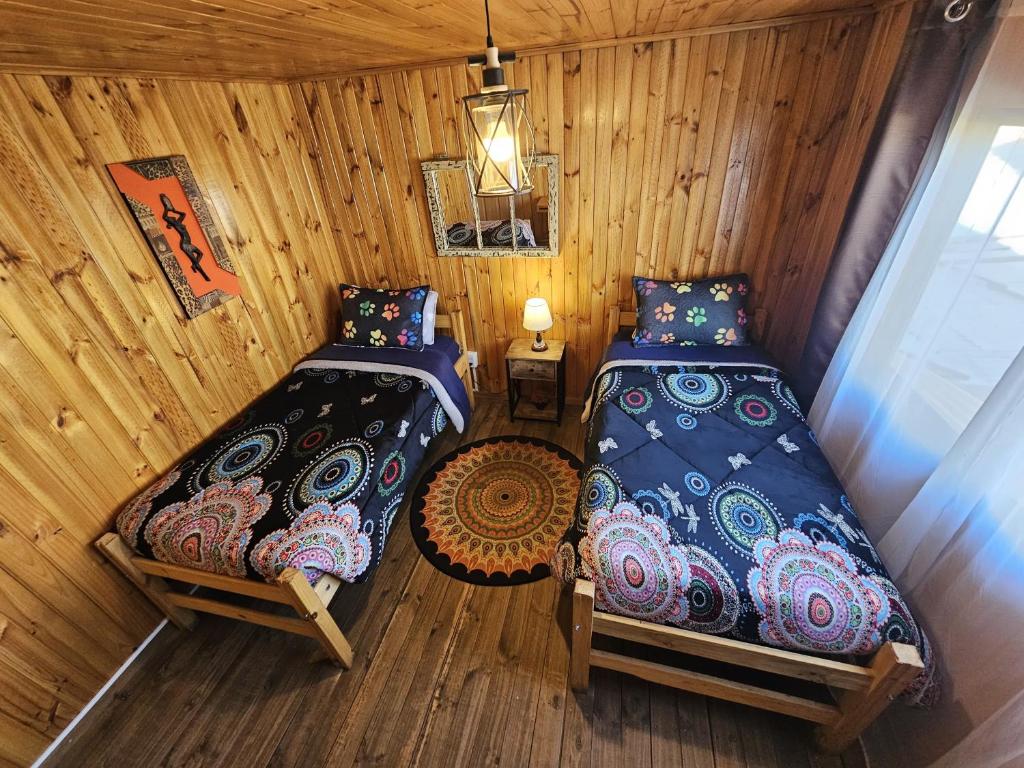Postel nebo postele na pokoji v ubytování Hostal Sol y Luna