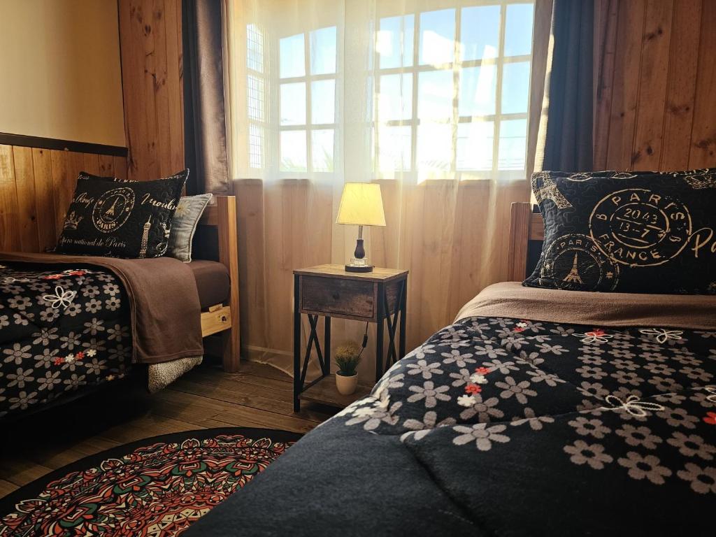 Postel nebo postele na pokoji v ubytování Hostal Sol y Luna
