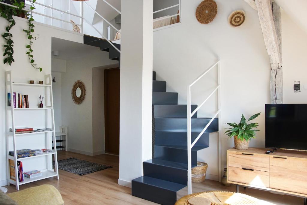 Μια τηλεόραση ή/και κέντρο ψυχαγωγίας στο Boho Apartment Kołobrzeg