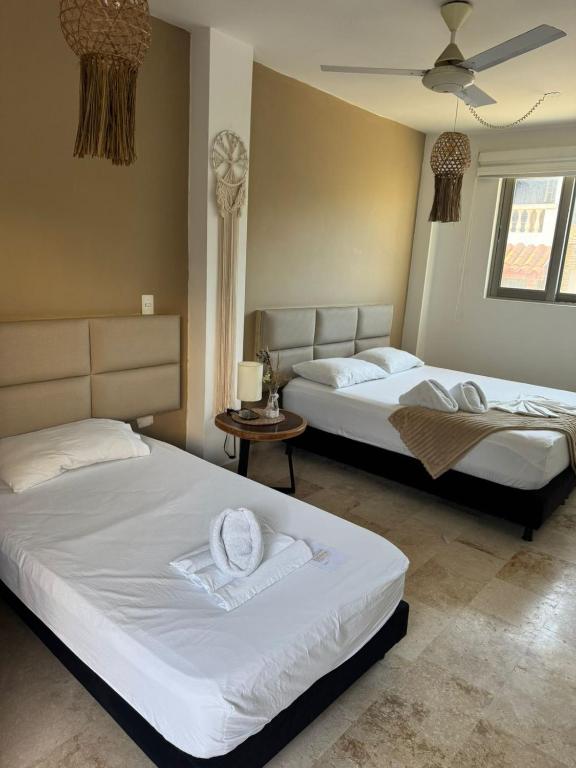 Voodi või voodid majutusasutuse Awa De Mar Hotel Tolu toas