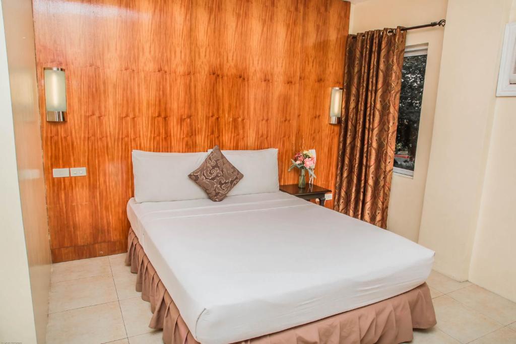 Postel nebo postele na pokoji v ubytování Viewpark Hotel Tagaytay