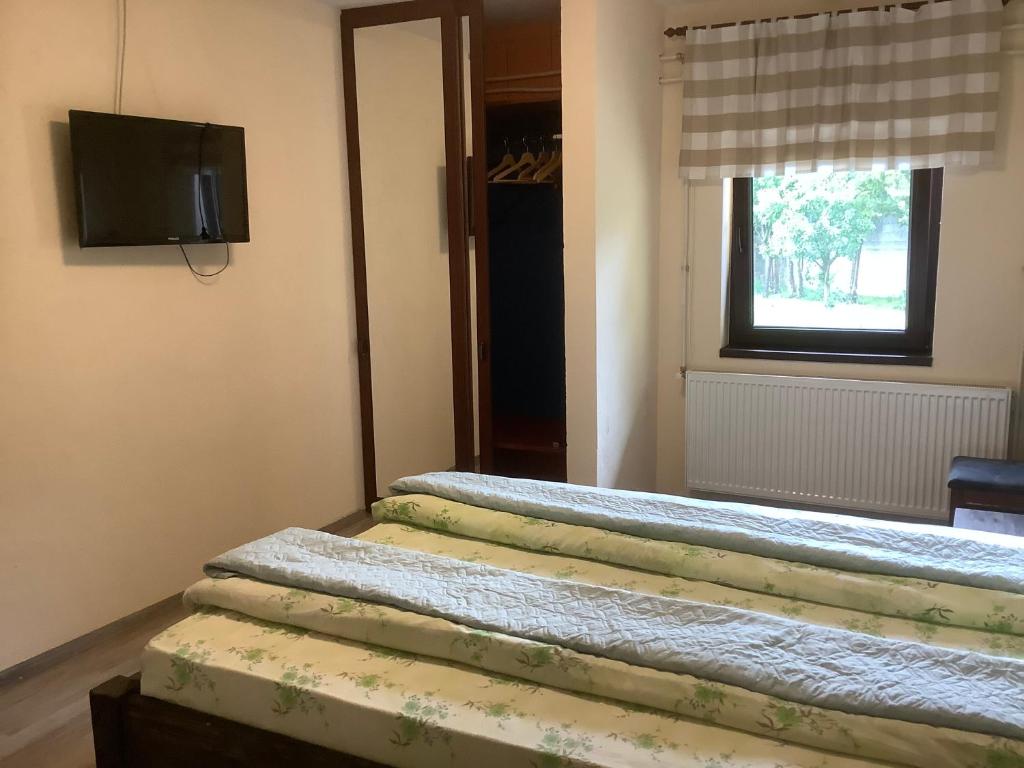 Postel nebo postele na pokoji v ubytování Garden Inn
