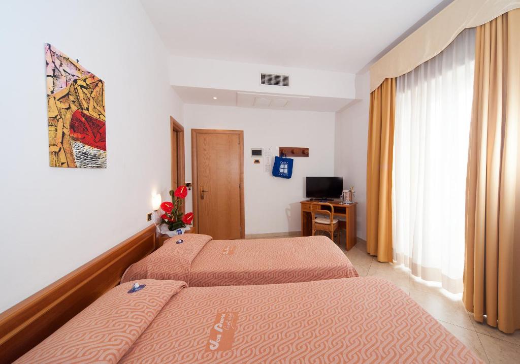 Postel nebo postele na pokoji v ubytování Joli Park Hotel - Caroli Hotels