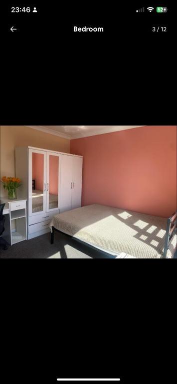 a bedroom with a large bed and a desk at Coven in Moffat