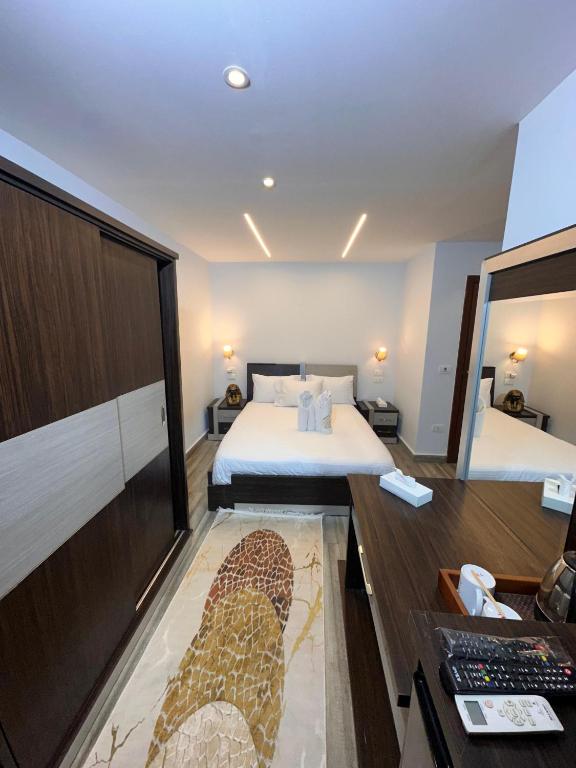 Postel nebo postele na pokoji v ubytování Kayan Pyramids Hotel